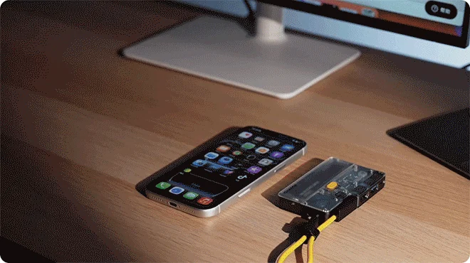 Smartphone and transparent Disk Pro 2 hub arranged together on a compact desk