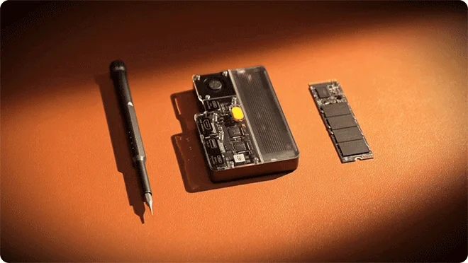 Disk Pro 2 enclosure beside a removable M.2 SSD and Torx screwdriver