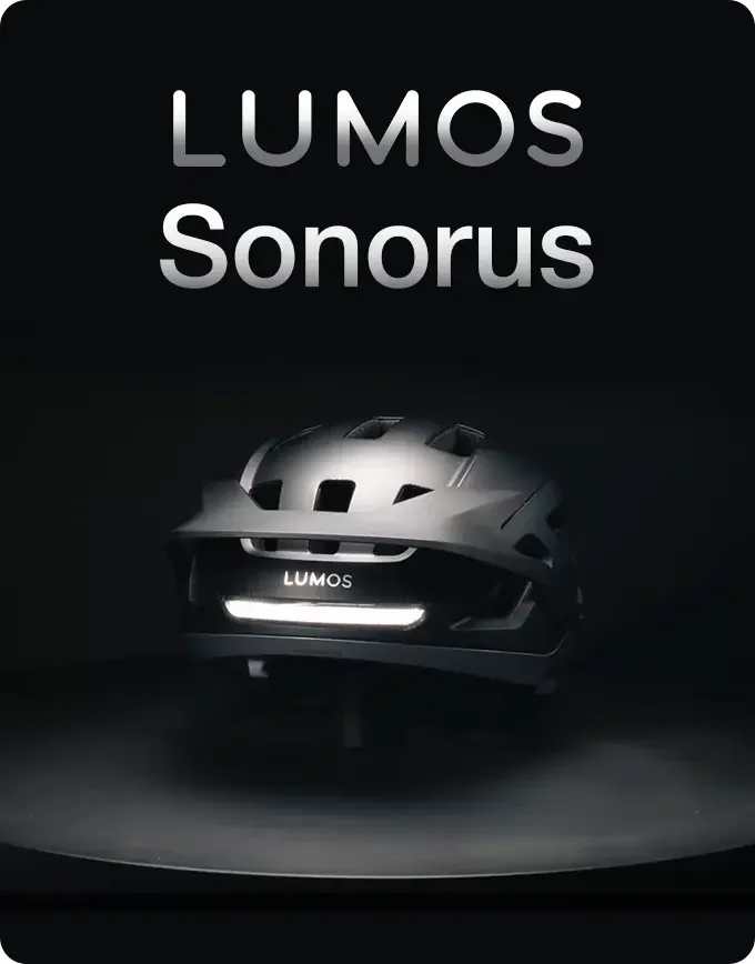 Black Lumos Sonorus cycling helmet illuminated from the rear