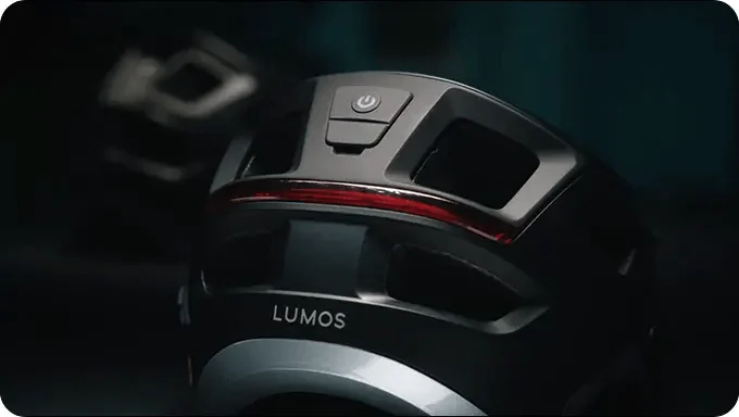 Close-up of the rear electronic control and light module on a black Sonorus helmet