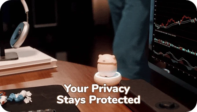 Sweekar resting on its charging base beside a computer under a privacy message
